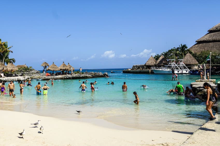 Sunbathe on Playa Paraiso beach and eat a typical dish on the waterfront.